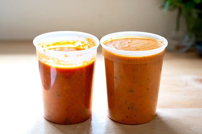 Two quarts of homemade tomato sauce on a counter top.