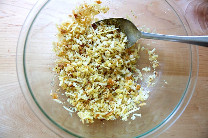 A bowl filled with the bread crumb topping for zucchini parmesan.