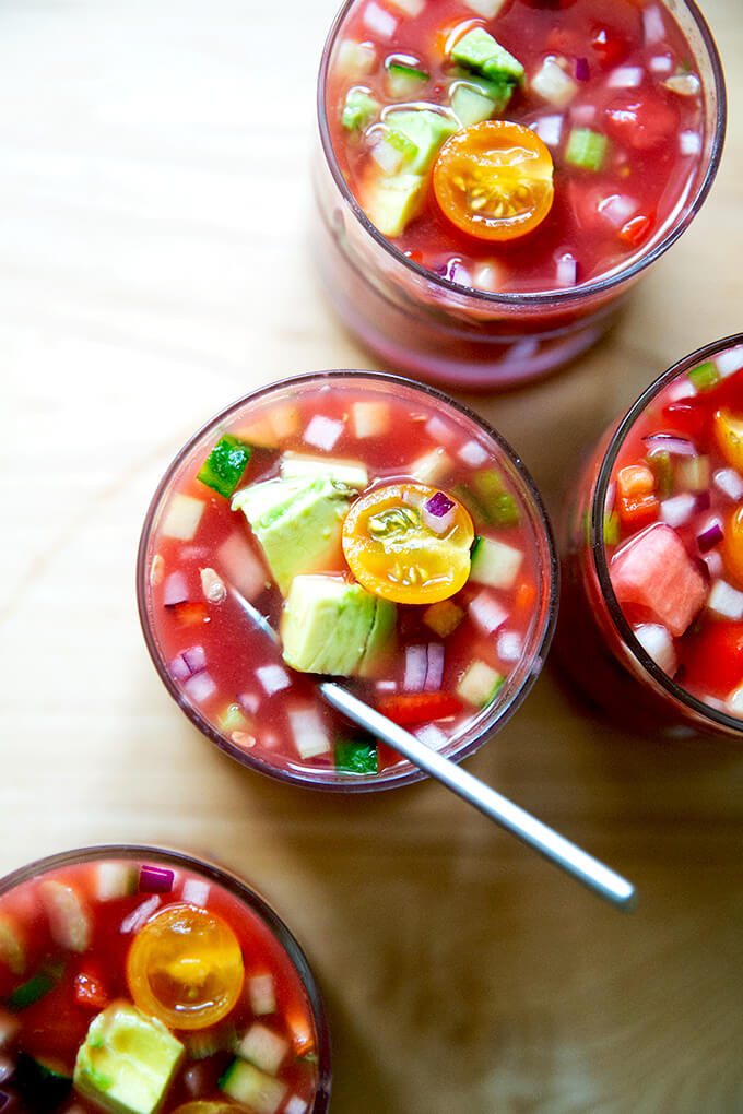 Small glassed filled with watermelon gazpacho.