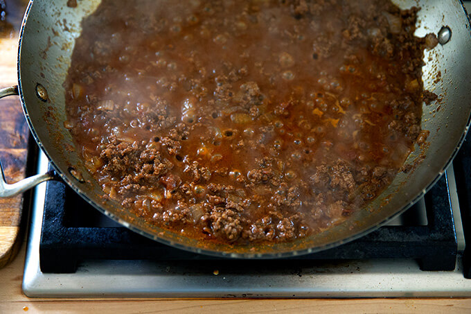 Taco mix simmering in a skillet. 
