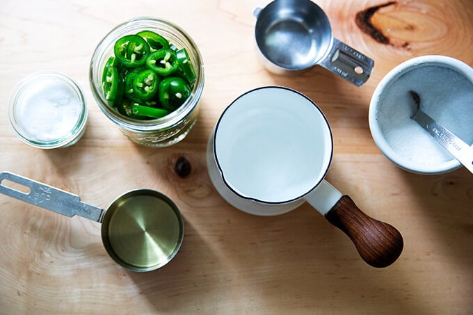 Ingredients for pickled jalapeños on a countertop.