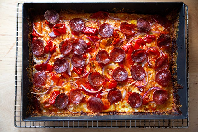 A just-baked Detroit-style pizza in pan. - 17
