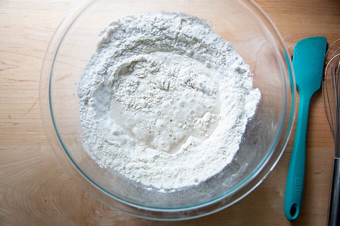 A bowl of flour, water, salt and yeast ready to be mixed into Detroit-style pizza dough.