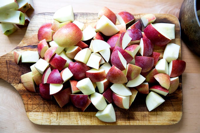 Cut apples on a board. 