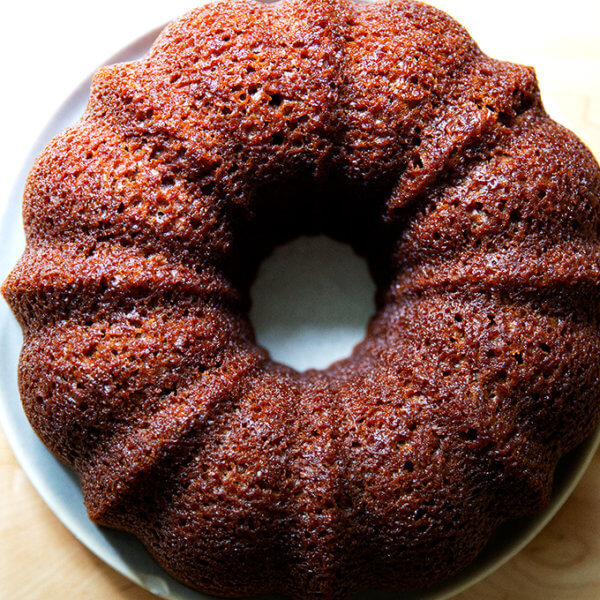 Just-baked applesauce bundt cake on a plate.