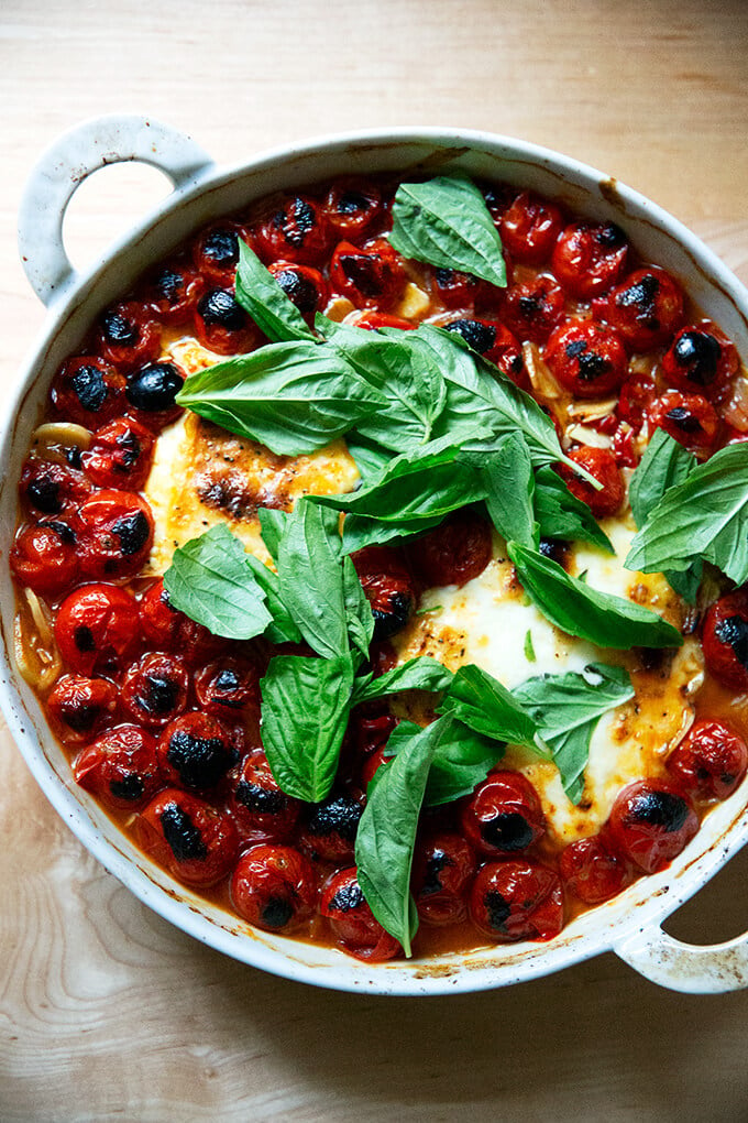 Broiled feta and tomatoes just out of the oven, showered with fresh basil.