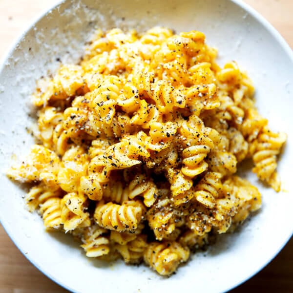 A bowl of pasta coated in butternut squash sage sauce.