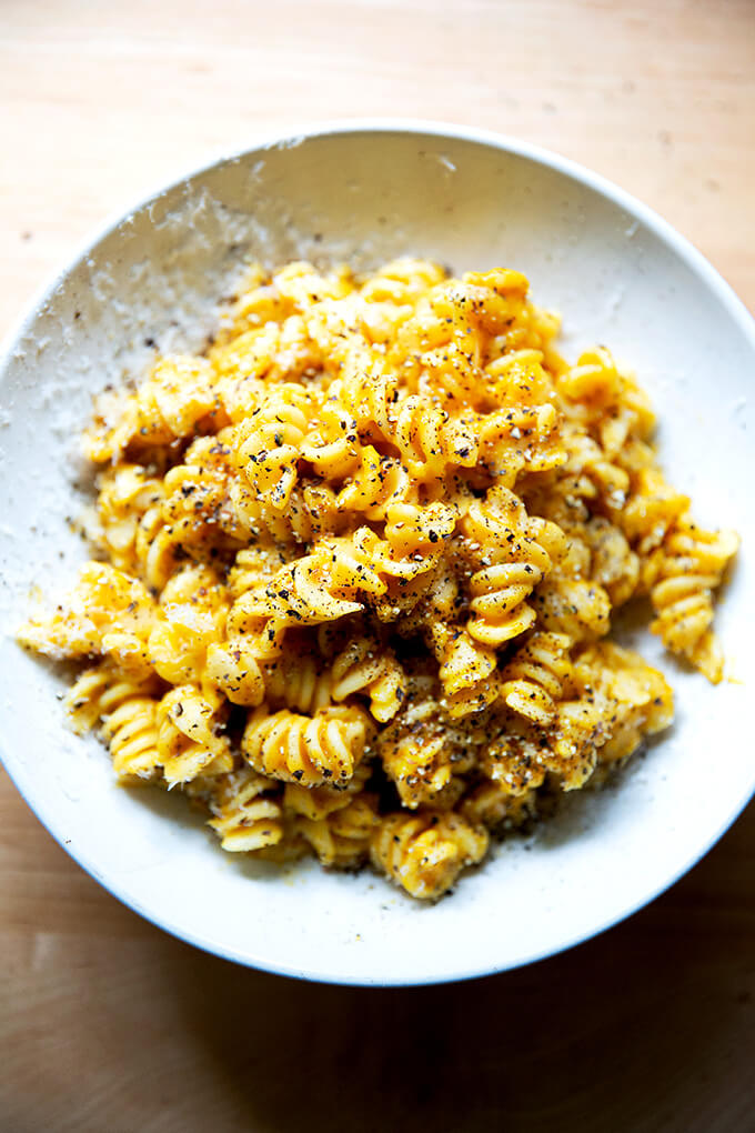 A bowl of pasta coated in butternut squash sage sauce.