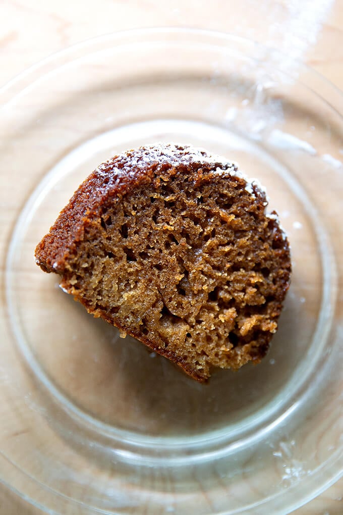 A slice of applesauce bundt cake on a platter.