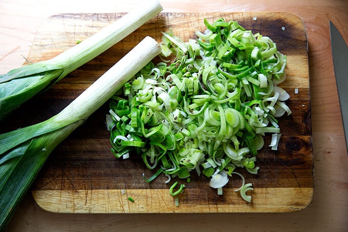 Sliced leeks on a cutting board.