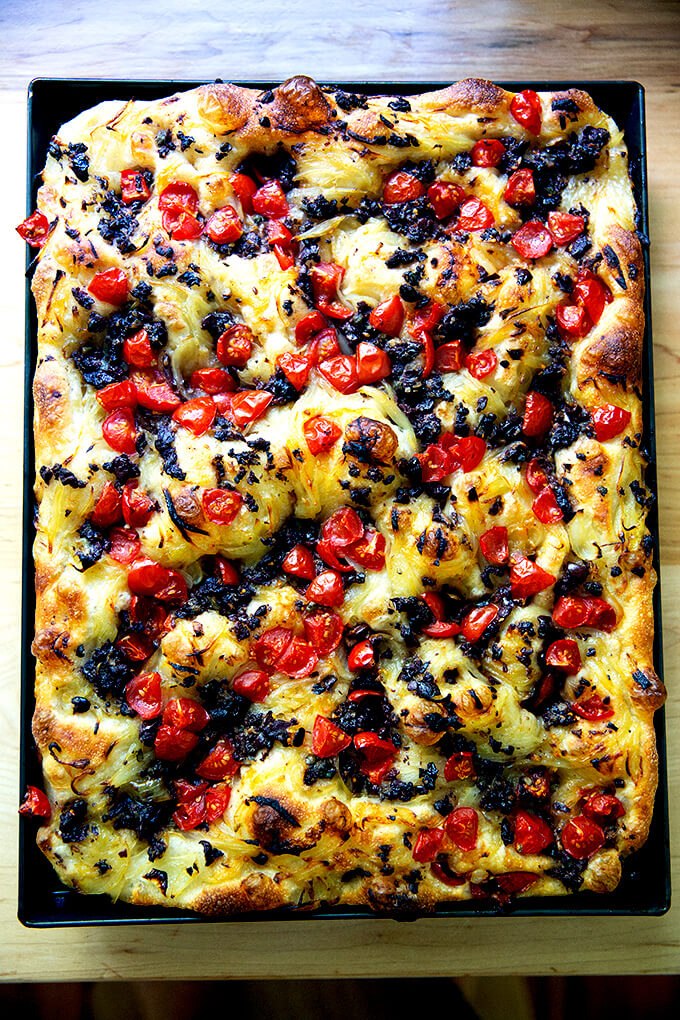 A large sheet pan holding just baked pissaladière.
