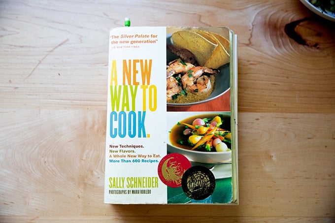 A cookbook, A New Way to Cook, on the counter.