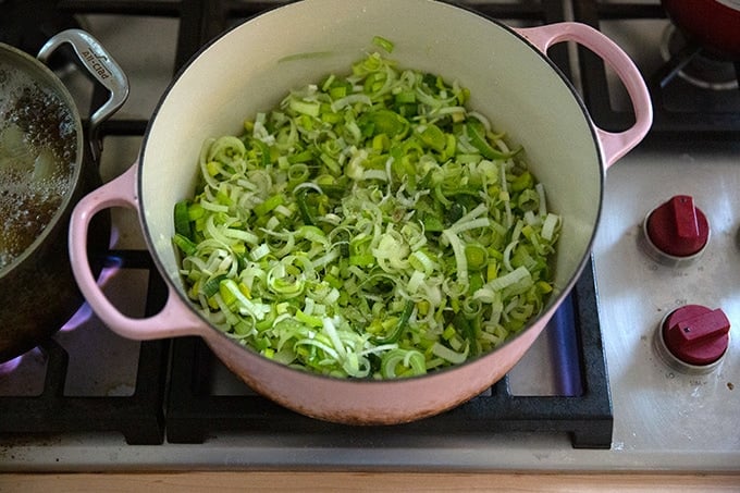 Leeks in a large soup pot beginning to sauté.