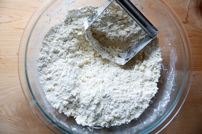 Butter cut into small pieces into a flour mixture a large bowl.
