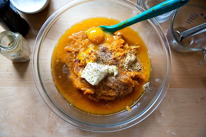 The filling for sweet potato casserole in a bowl but unstirred.