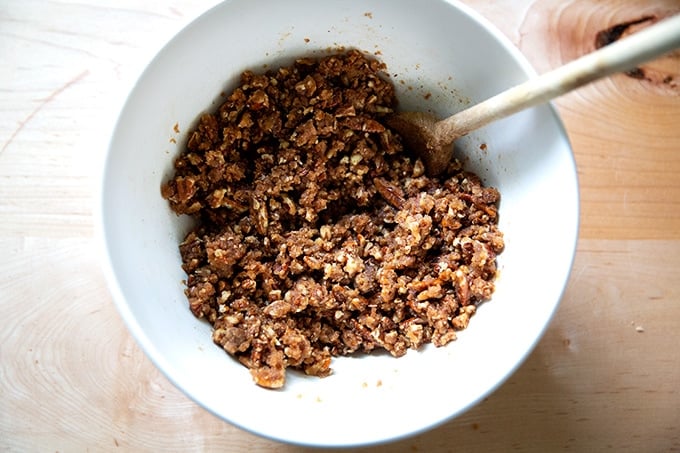 The topping for a sweet potato casserole stirred together in a bowl.