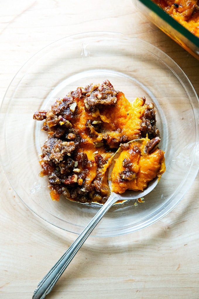 A scoop of sweet potato casserole on a plate.