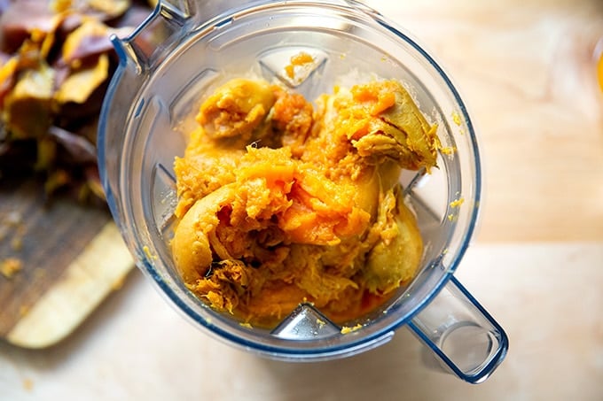 Boiled sweet potatoes in a blender.