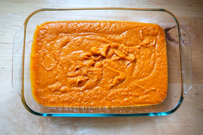 A sweet potato purée in a 9x13-inch dish.