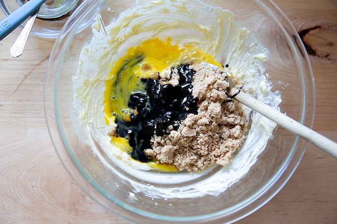 Wet ingredients to make molasses cookies unmixed in a large bowl.