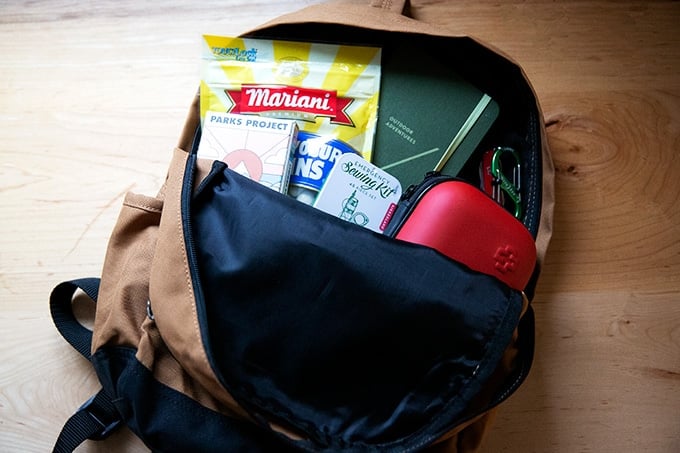 Open Carhart backpack on a countertop.