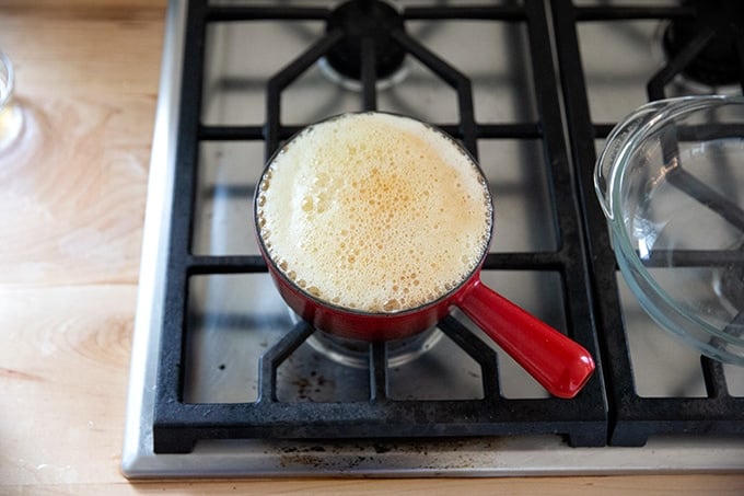 Butter browning in a sauce pan on the stovetop.