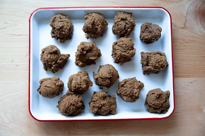 Portioned cookie dough balls on a tray.