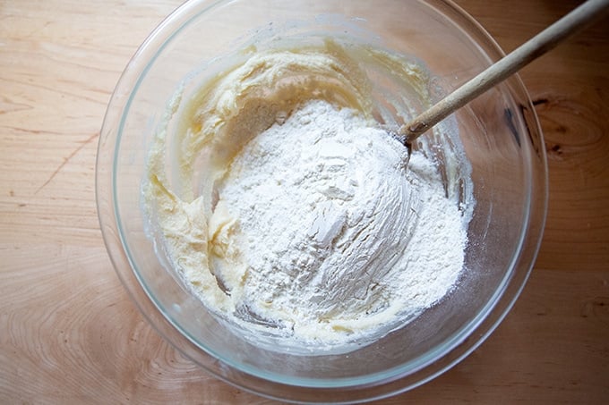 A bowl of softened butter, salt, sugar, vanilla, and flour.