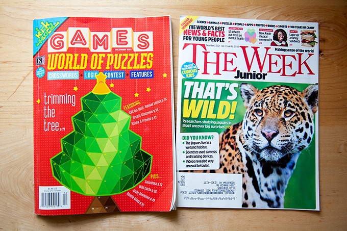 Two magazines on a countertop: Games & The Week Junior