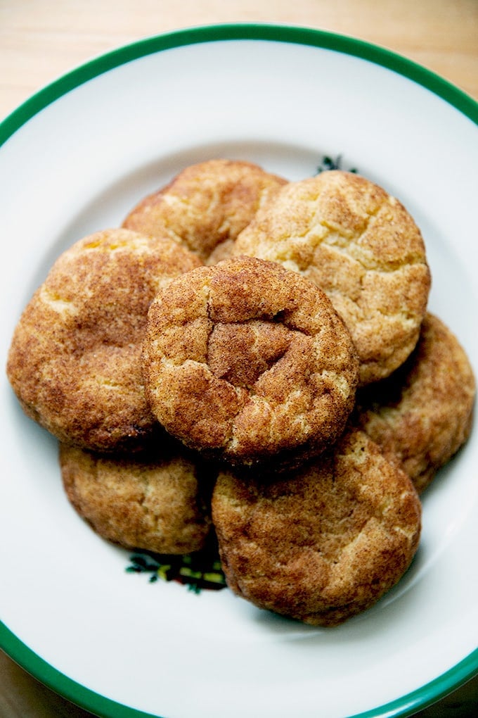 Just baked brown butter snickerdoodles on a plate.