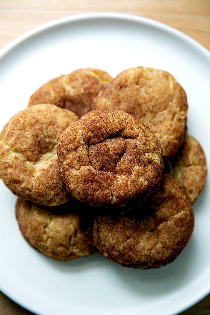 Just baked brown butter snickerdoodles on a plate.