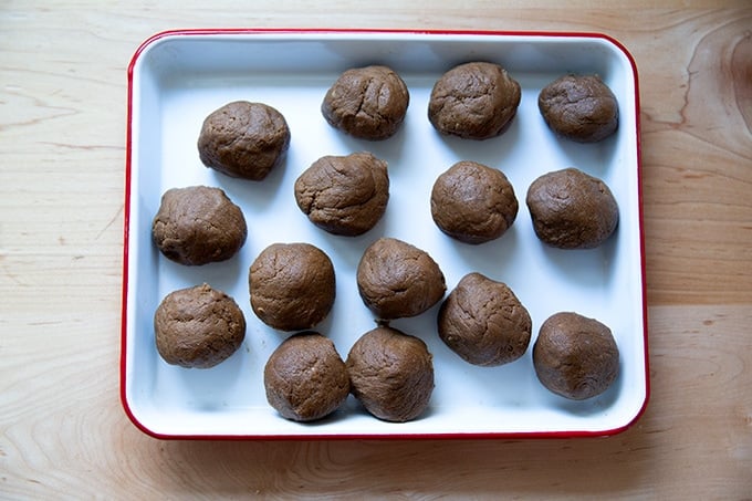 Rolled molasses cookie dough balls.