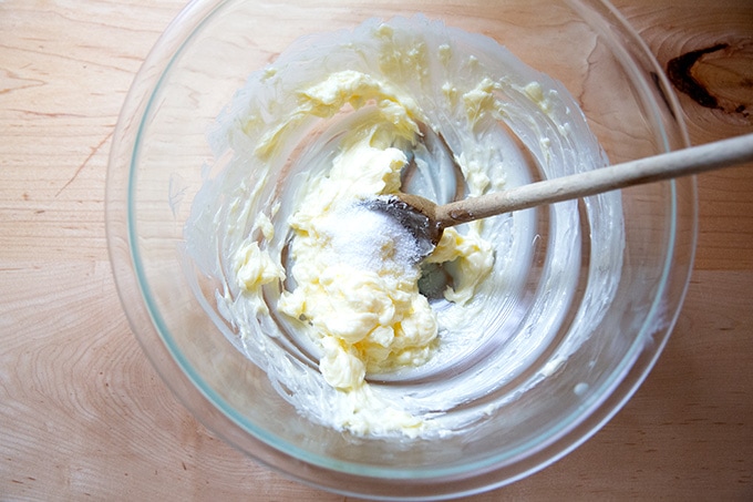 A bowl of softened butter and salt.
