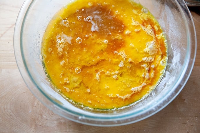 A bowl filled with the ingredients to make brown butter snickerdoodles, unmixed.