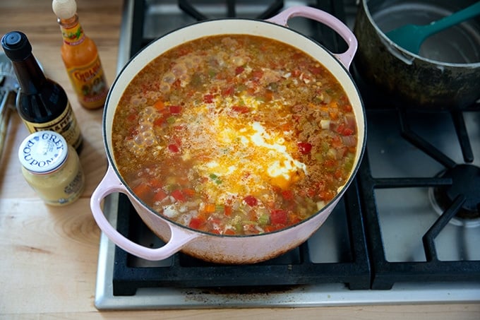 A large pot of Vermont cheddar cheese soup on the stovetop.