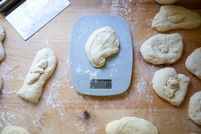 A portion of soft pretzel dough on a scale.