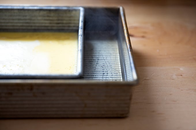 A pan of eggs set inside another pan with 1/2-inch of water.