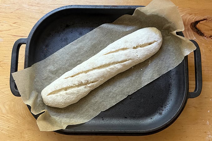 A baguette in a Challenger Bread Pan at the start of its bake.