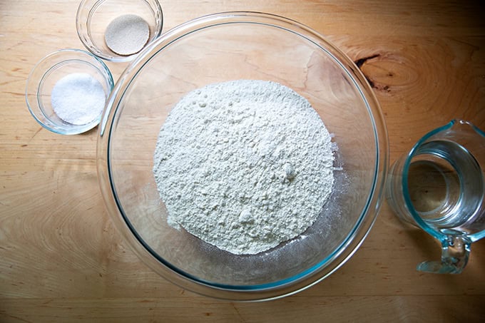 The ingredients to make baguettes on a countertop.