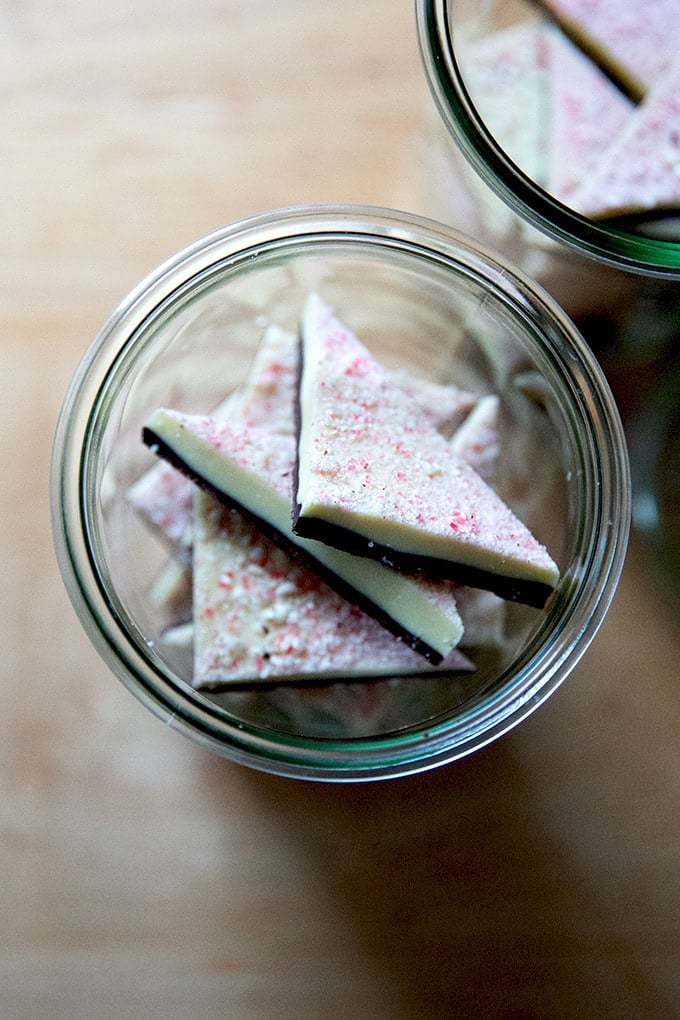 Overhead shot of peppermint bark in glass jars.