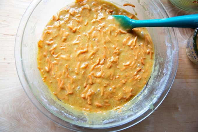 A bowl of mixed carrot cake batter.