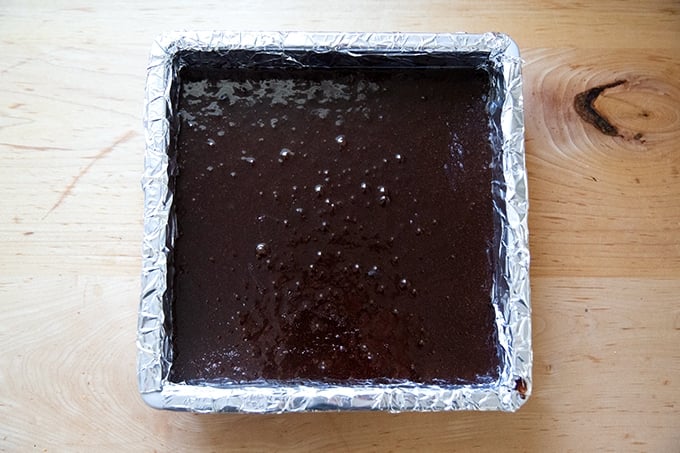 Brownie batter in a pan ready for the oven.