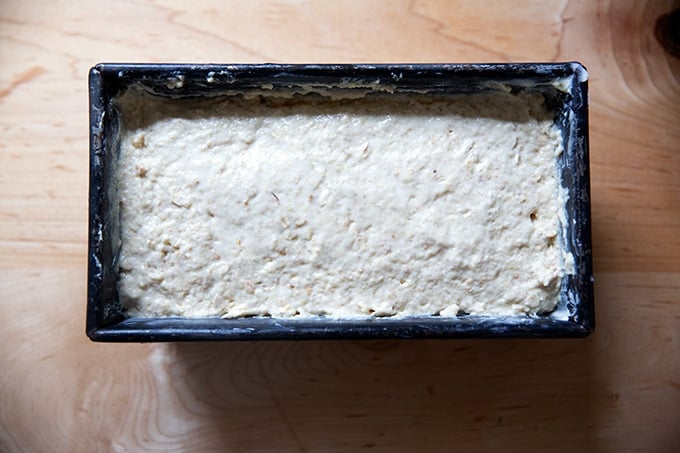 Irish brown bread batter in a buttered loaf pan.