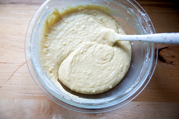 A large bowl filled with the batter to make pound cake.