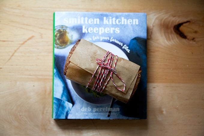 Smitten Kitchen Keepers along with a loaf of wrapped pound cake.