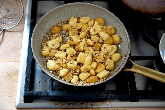 Brown butter gnocchi in a skillet.