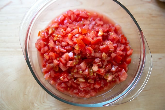 A bowl of chopped tomatoes.