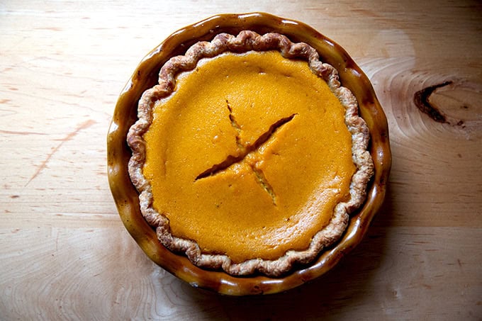 A just-baked butternut squash pie, with a cracked top.