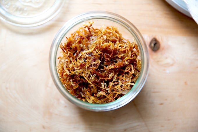 A jar filled with crispy fried shallots.