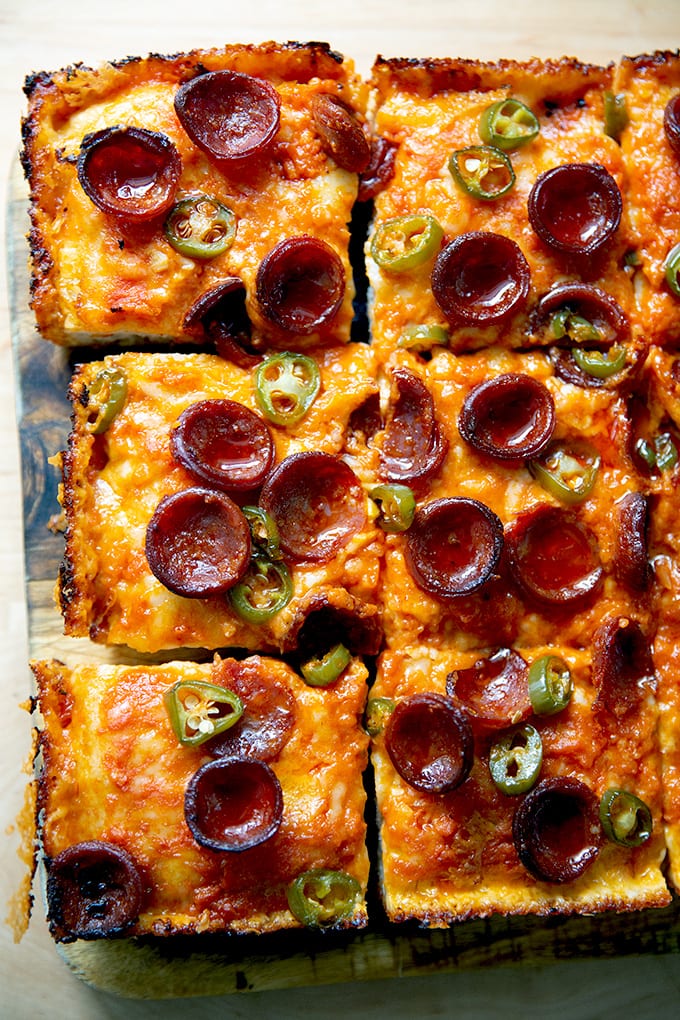 Just baked Detroit-style pizza topped with pepperoni and pickled jalapeños.